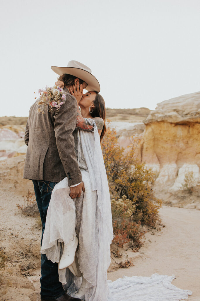 newly eloped couple kissing 