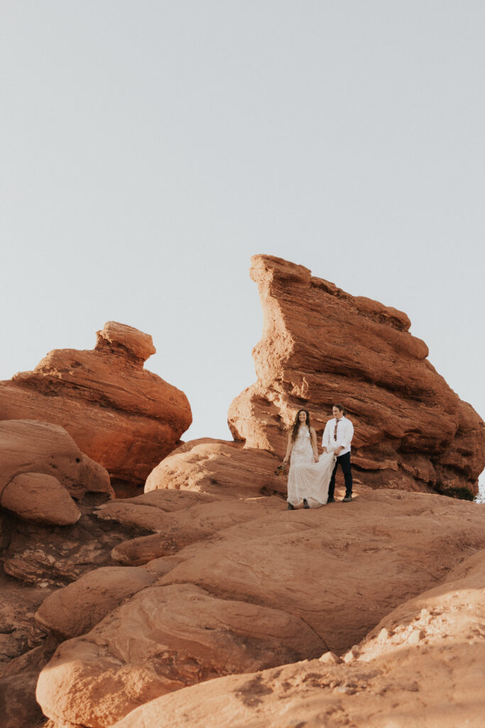 holding dress in the red rocks 
