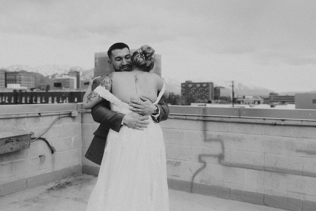 bride and groom doing a first look on a rooftop in salt lake city