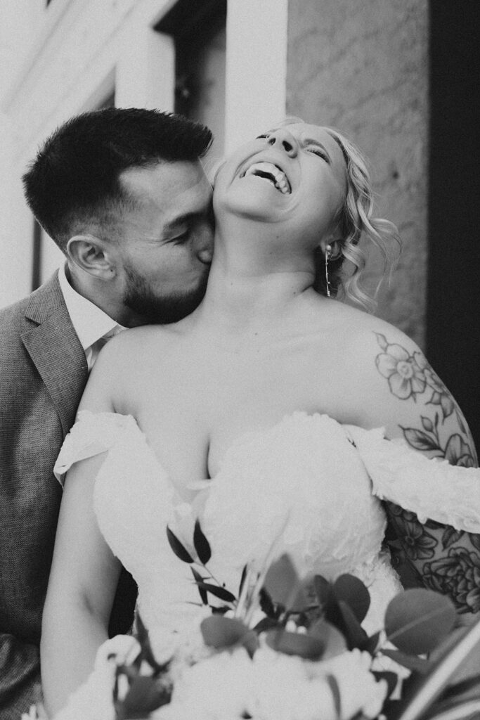 bride and groom posing on the street for their wedding photos - salt lake city wedding