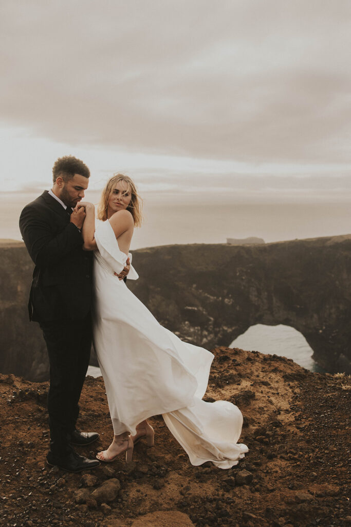 couple having an adventure wedding on a beach in iceland
