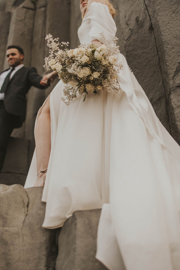 couple having an adventure wedding on a beach in iceland