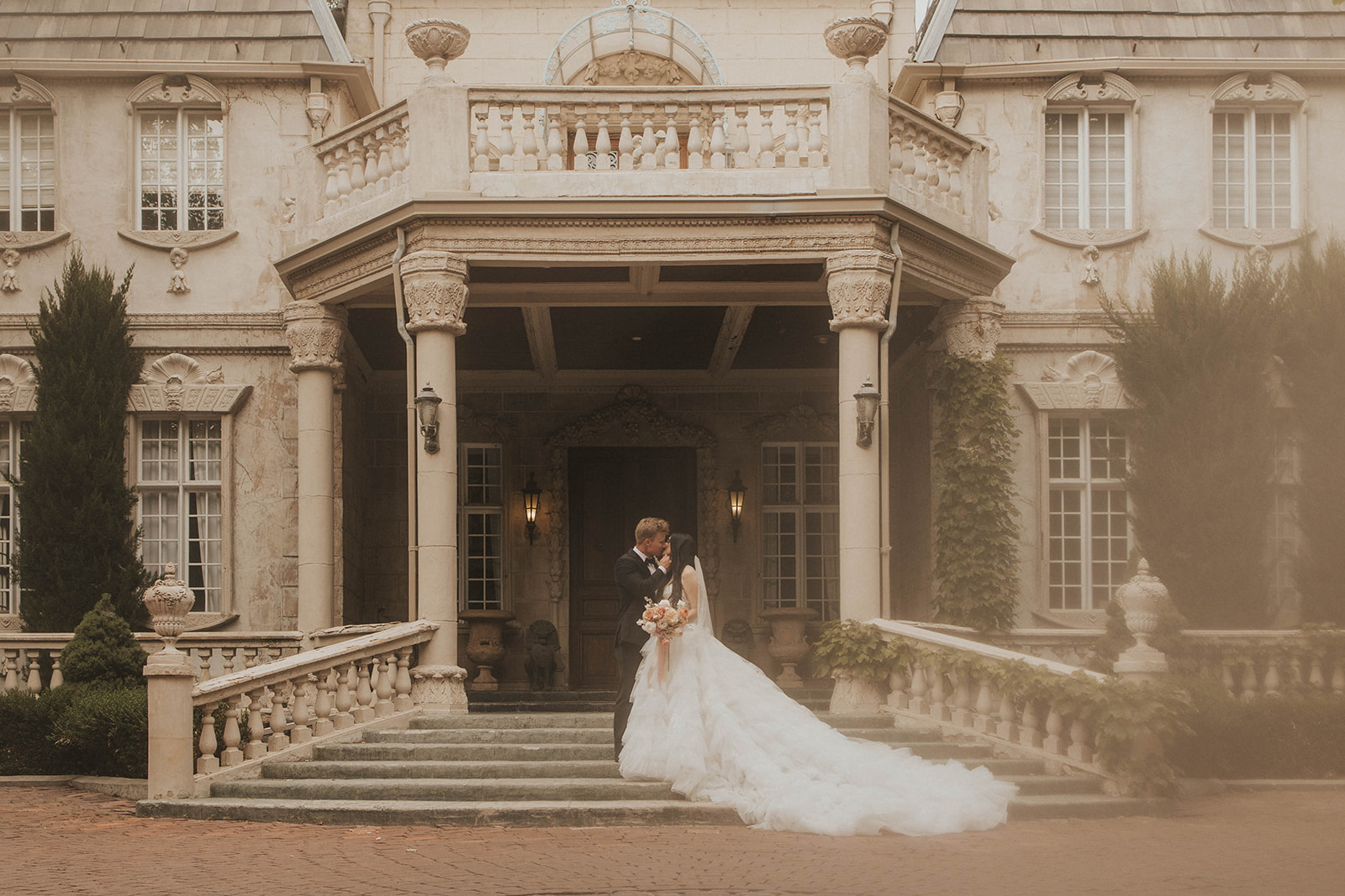couple posing for their wedding portraits - la caille in utah