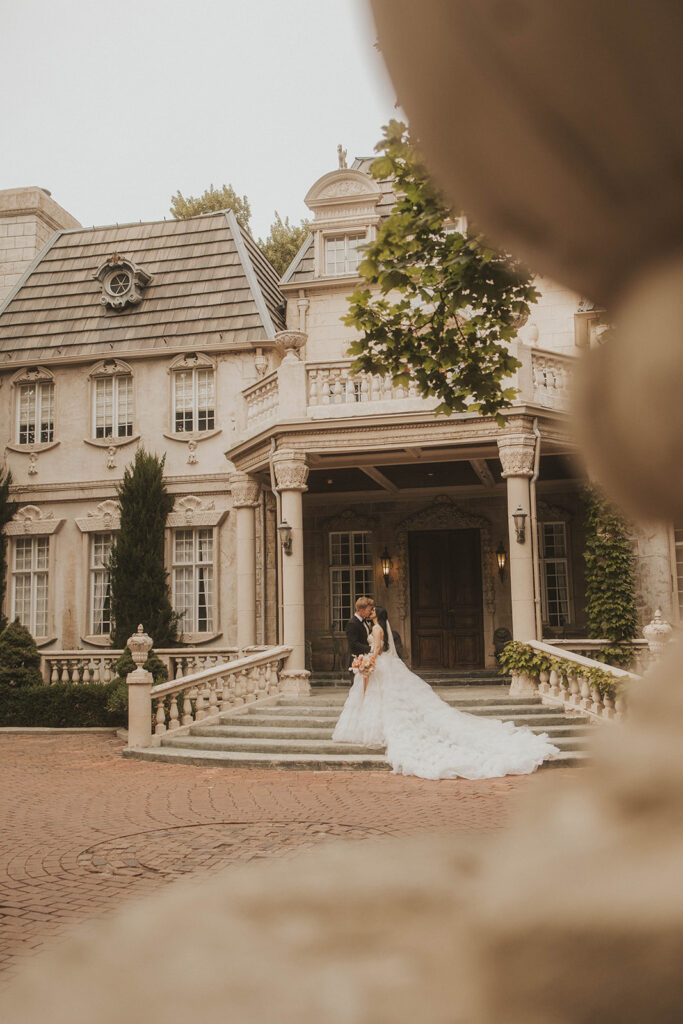 couple posing for their wedding portraits - la caille in utah
