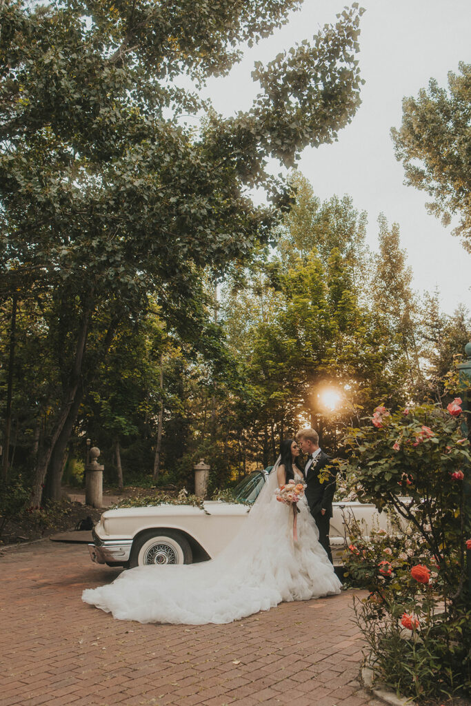 bride and groom posing in utah at la caille for their wedding portraits