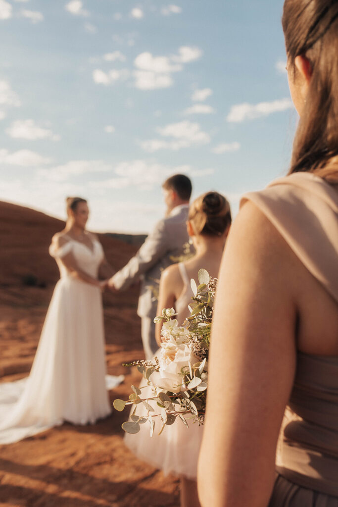 Couple posing for their wedding photos at snow canyon state park
