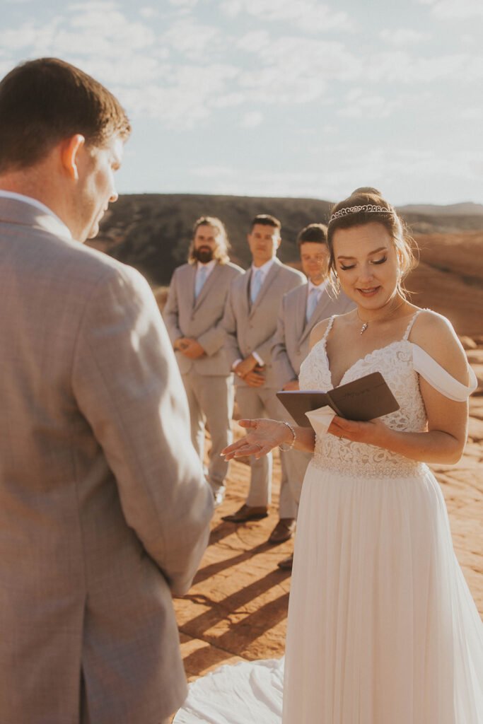 Couple posing for their wedding photos at snow canyon state park
