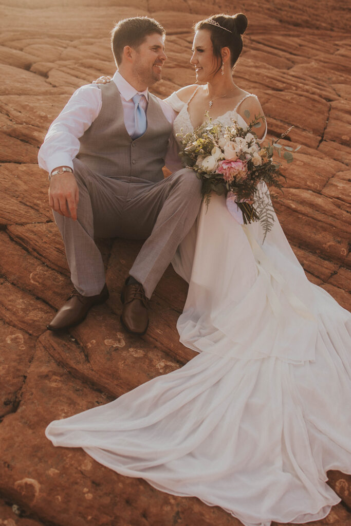 bride and groom in utah posing for their adventure wedding photos
