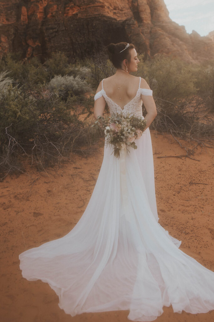 Couple posing for their wedding photos at snow canyon state park
