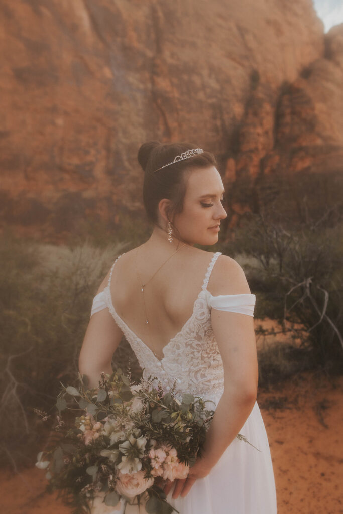 Couple posing for their wedding photos at snow canyon state park
