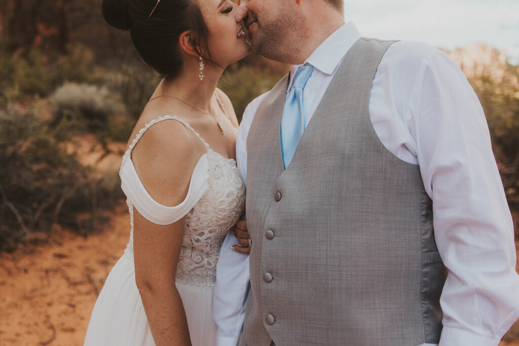 bride and groom in utah posing for their adventure wedding photos
