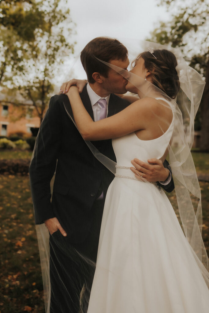 bride and groom posing for wedding portraits