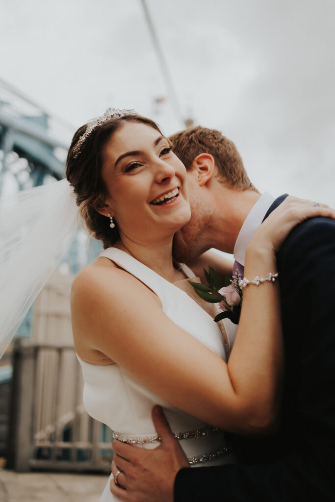 bride and groom posing for wedding portraits