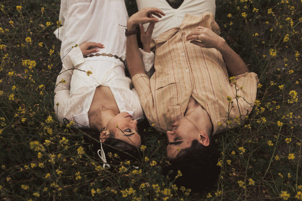 couple posing for their elopement photos in a costa rica field
