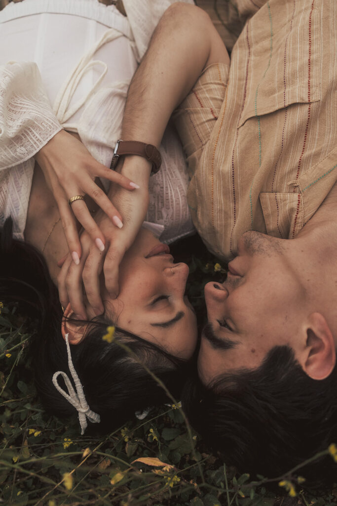 couple posing for their elopement photos in a costa rica field