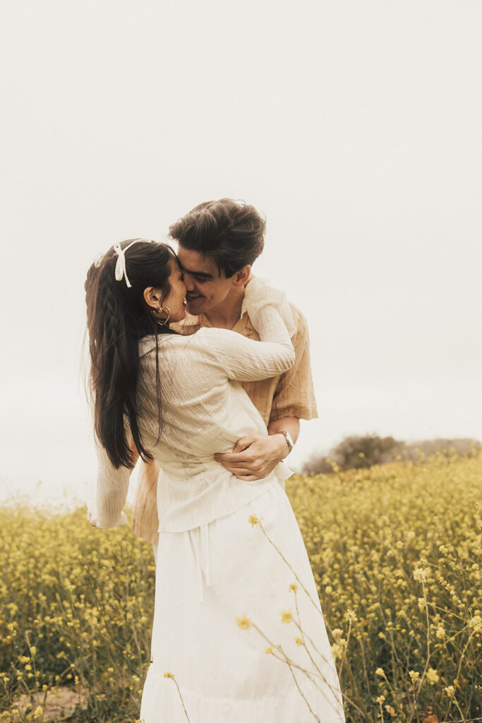 couple posing for their elopement photos in a costa rica field
