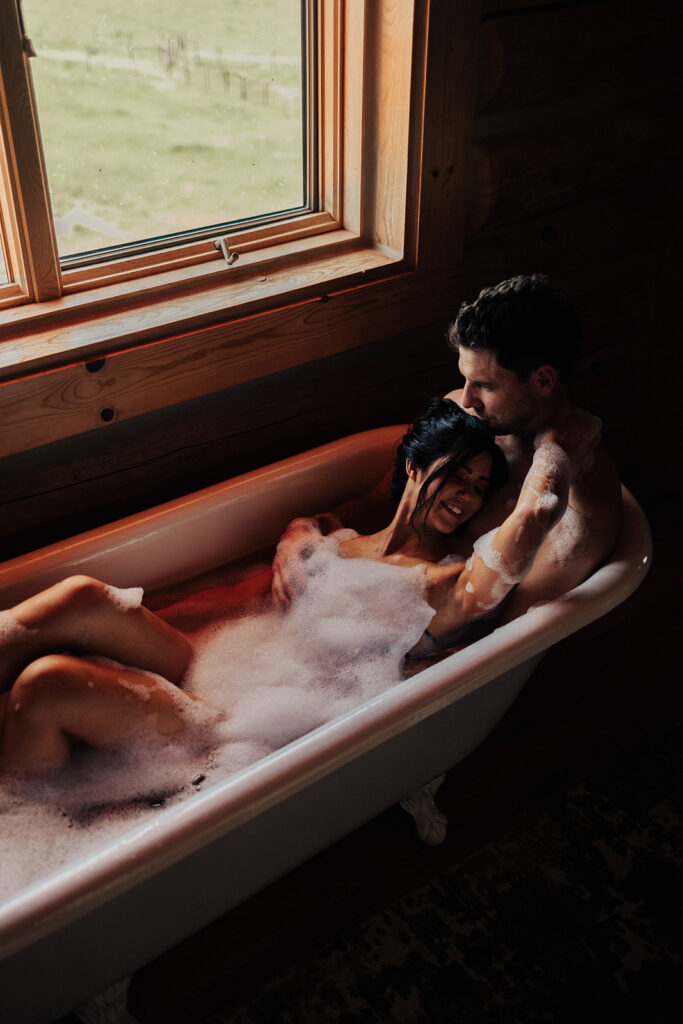 couple posing in a bubble bath