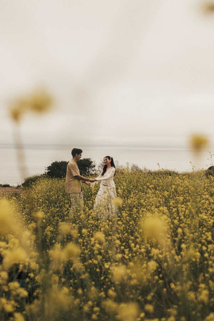 couple posing for an elopement photoshoot on a beach in costa rica