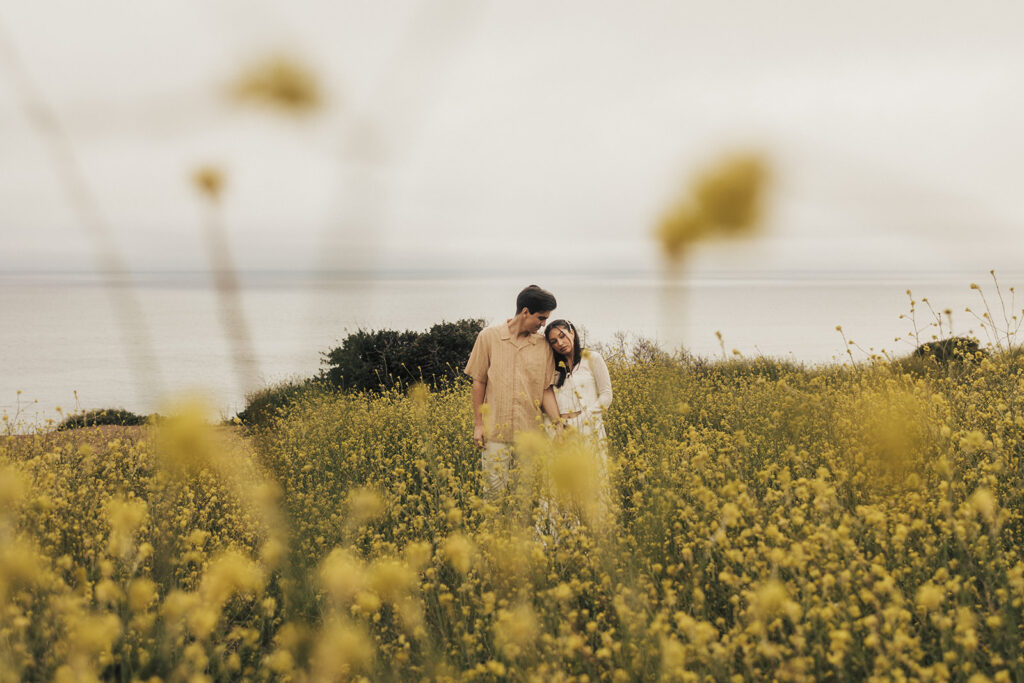 couple posing for an elopement photoshoot on a beach in costa rica