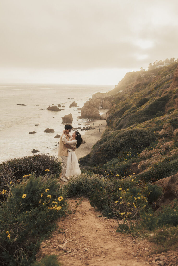 couple posing for an elopement photoshoot on a beach in costa rica