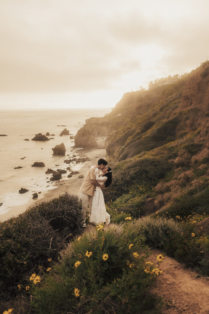 couple posing for an elopement photoshoot on a beach in costa rica