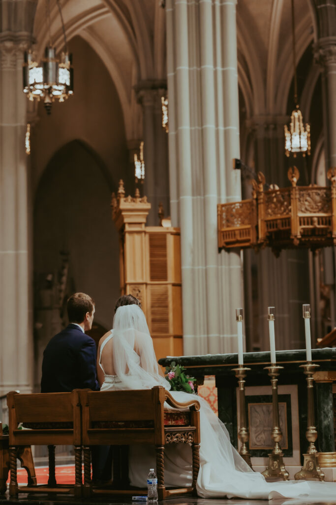 bride and groom posing for wedding portraits