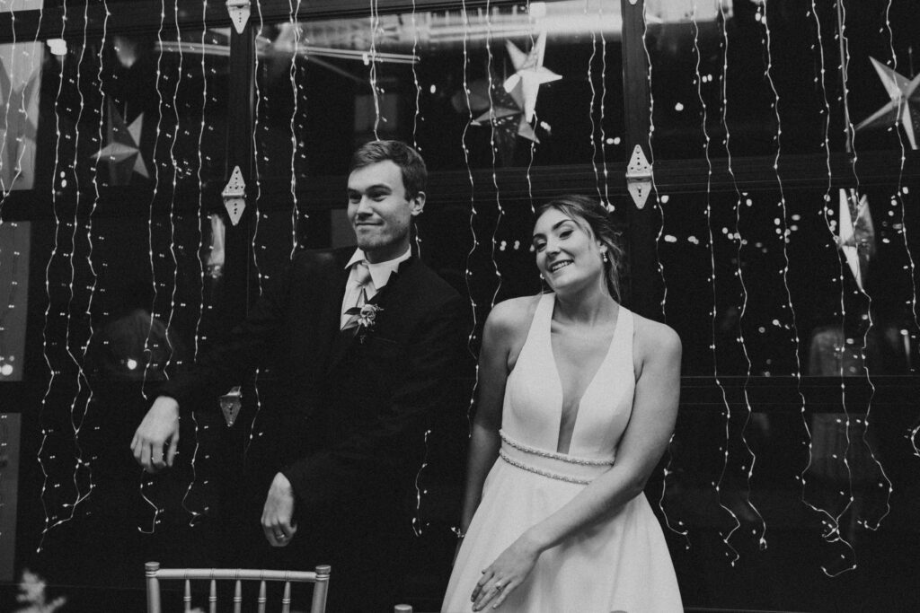 bride and groom posing for wedding portraits