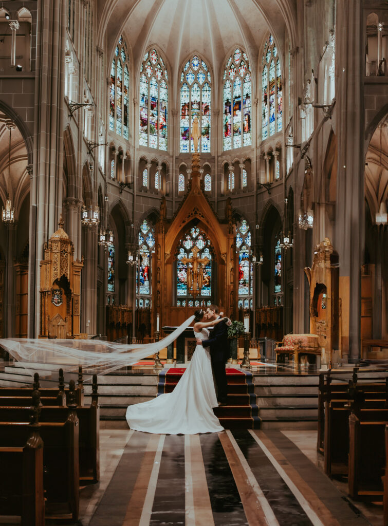 bride and groom posing for wedding portraits