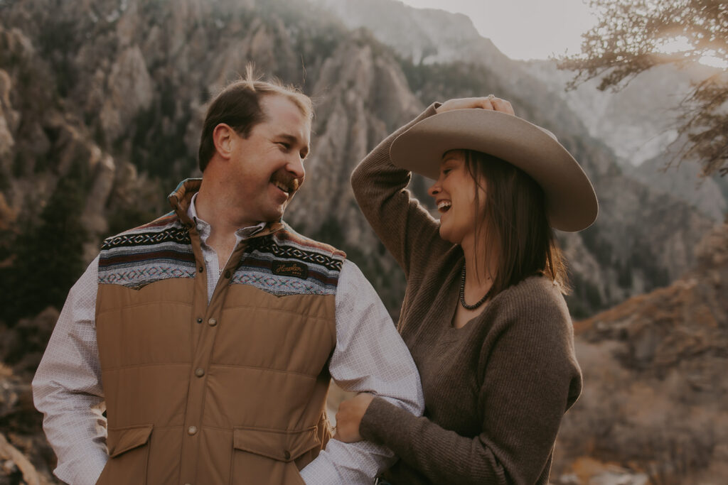 couple looking at each other with storm mountain as the backdrop