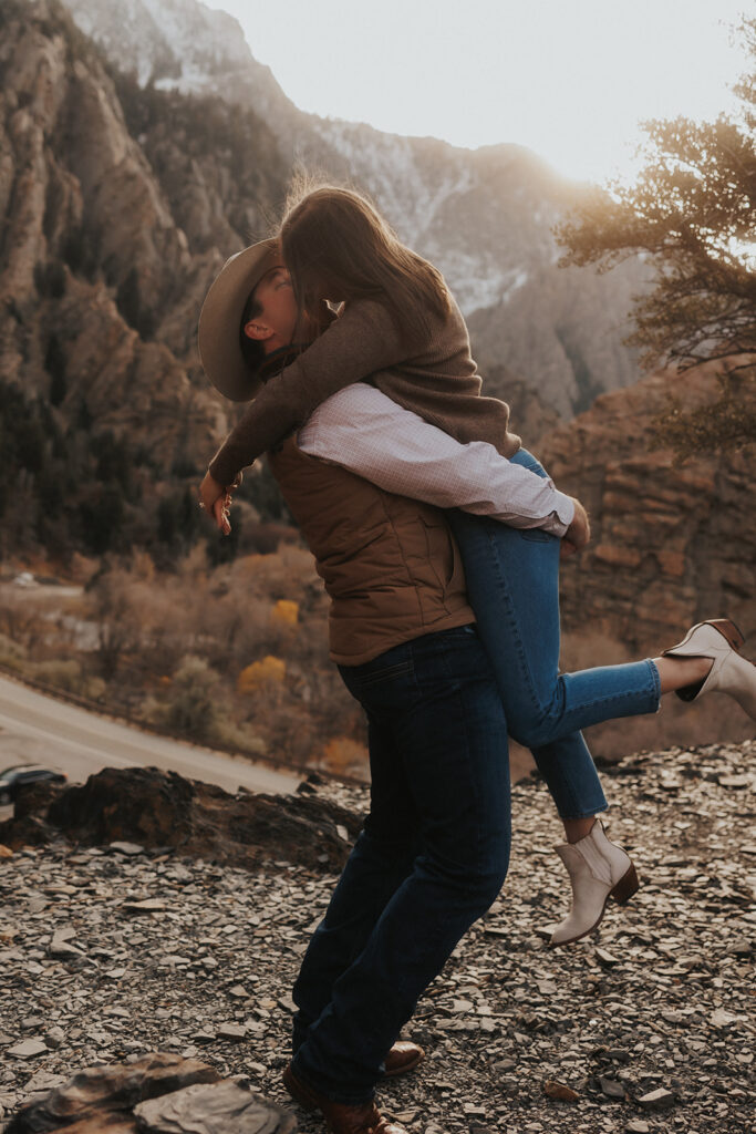 couple kissing at storm mountain in utah
