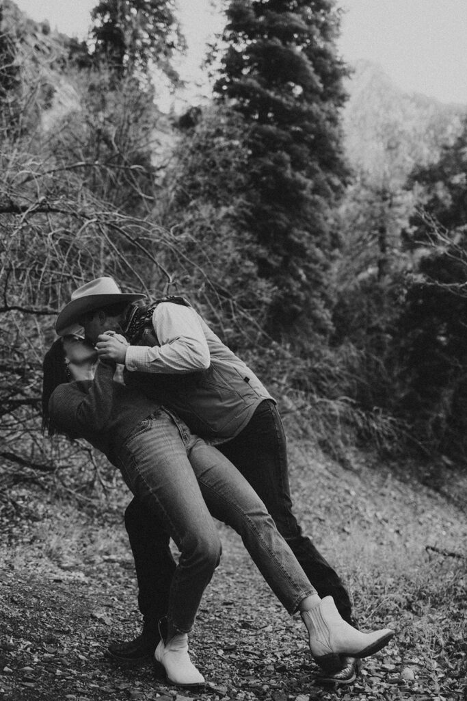 black and white photo of the couple kissing