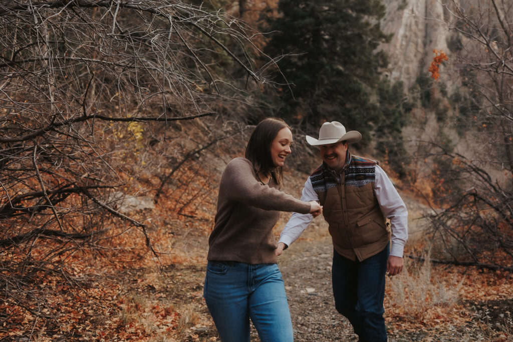 beautiful couple playing during their photoshoot wedding photography
