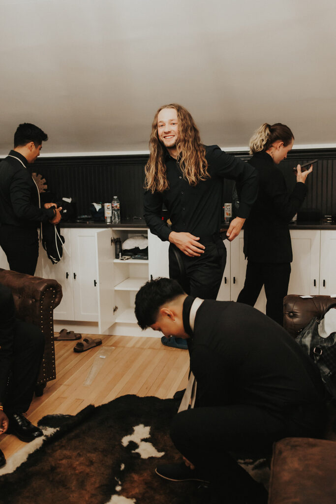 Groom getting read with his friends before the ceremony