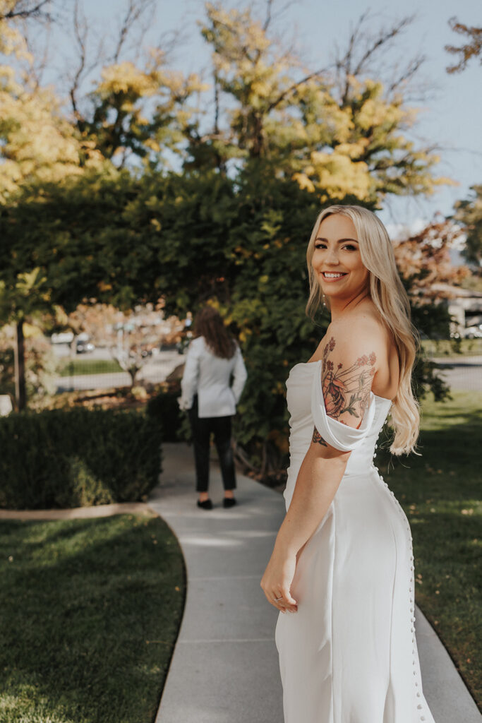 Bride behind the groom before their first look at their intimate wedding at La Capella