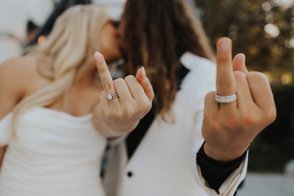 Bride and Groom showing their rings