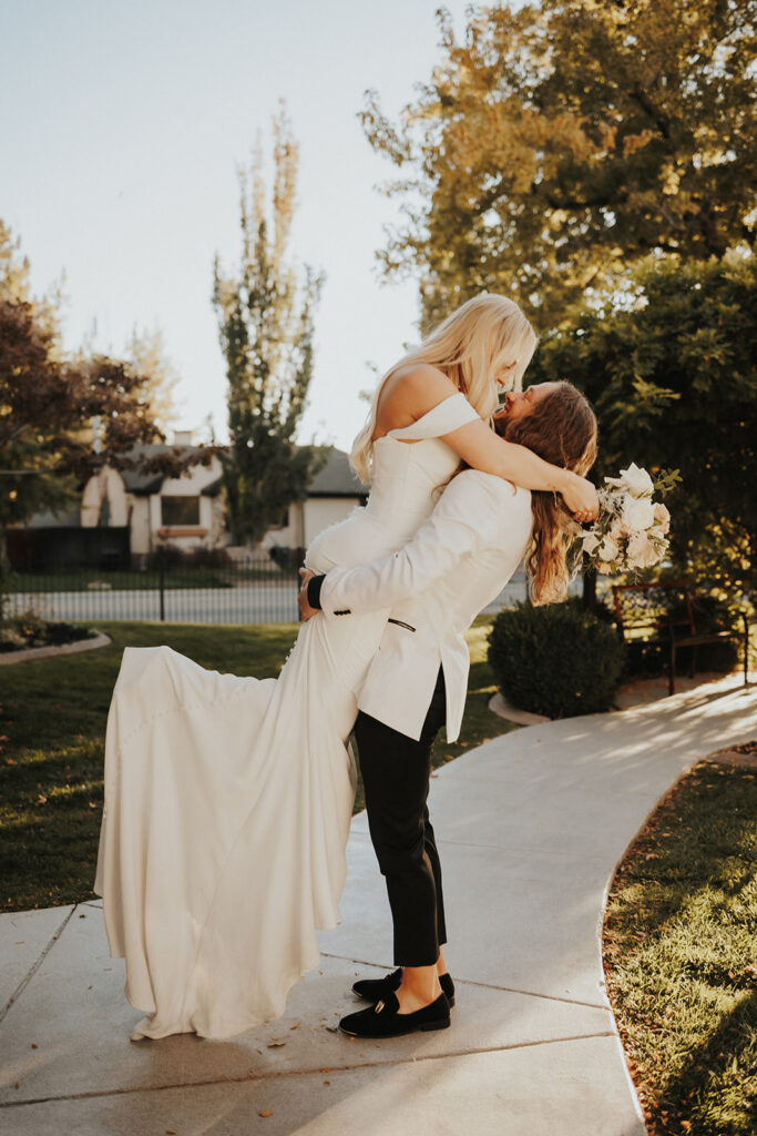 Groom picking up the bride while looking at each other