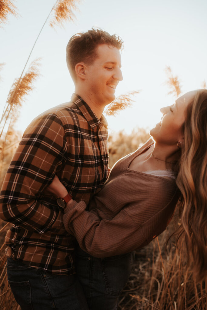 couple smiling looking at each other 