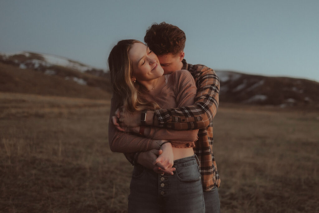 gorgeous couple hugging during their adventurous engagement session 