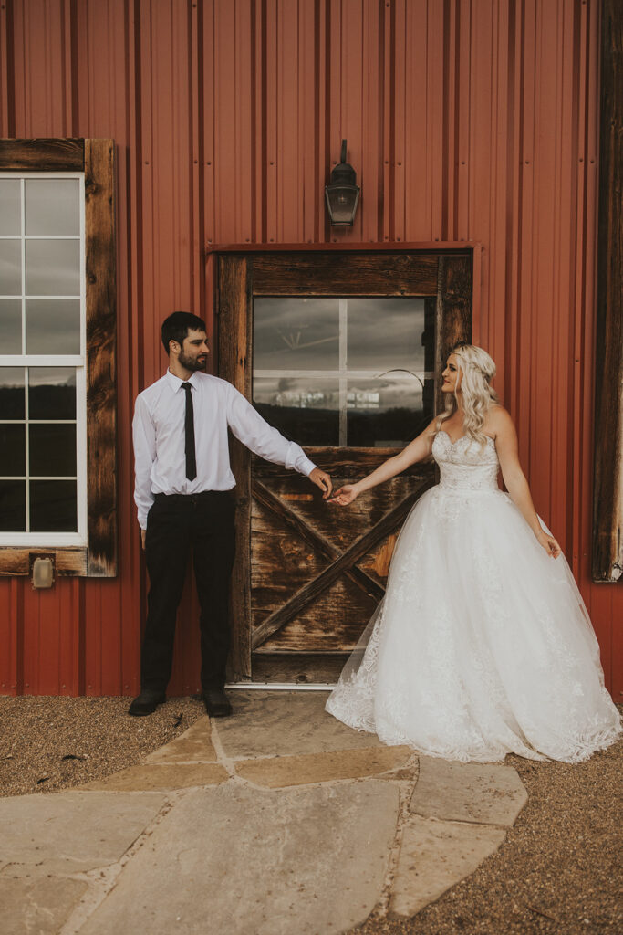 newly married couple holding hands at their western wedding