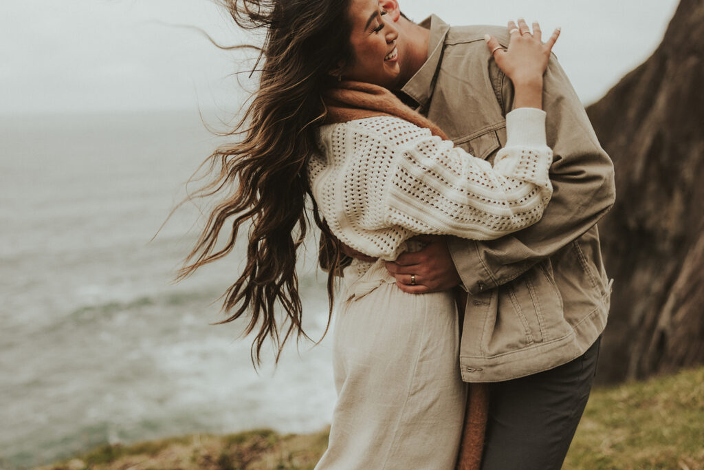 couple laughing during their mountain session