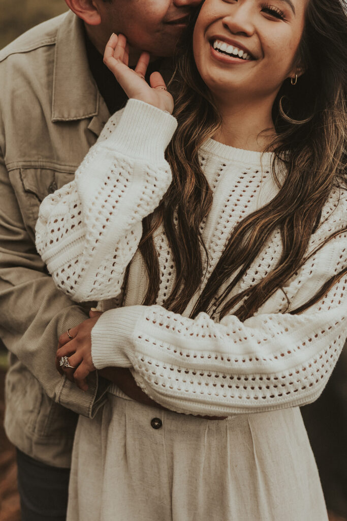 boyfriend kissing her girlfriend on the cheek