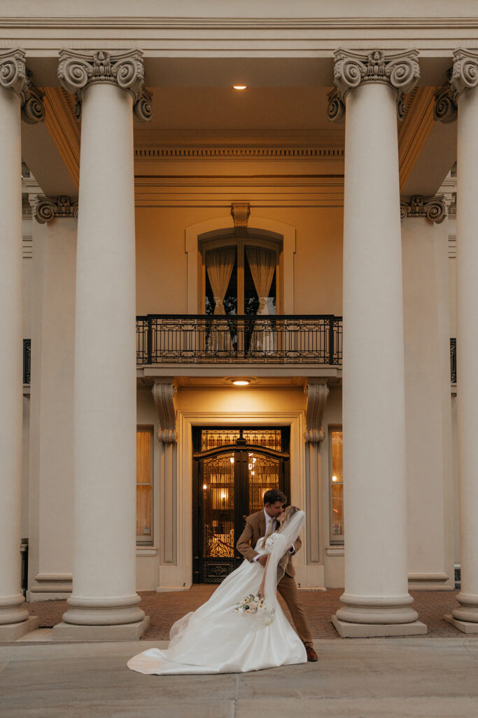 picture of the bride and groom kissing 