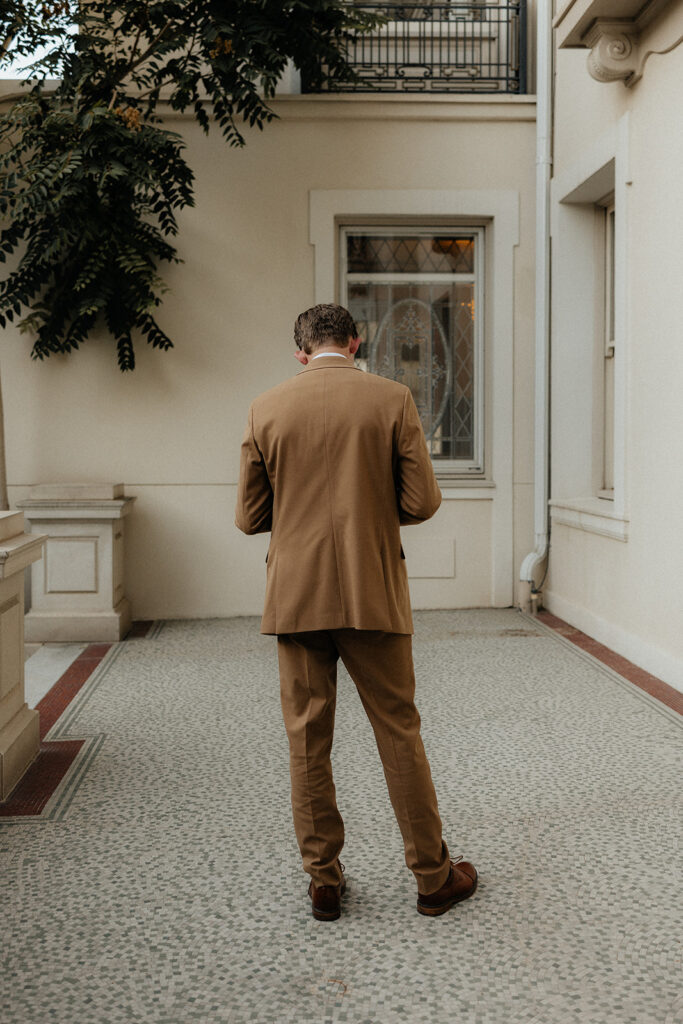 groom at his first look with the bride