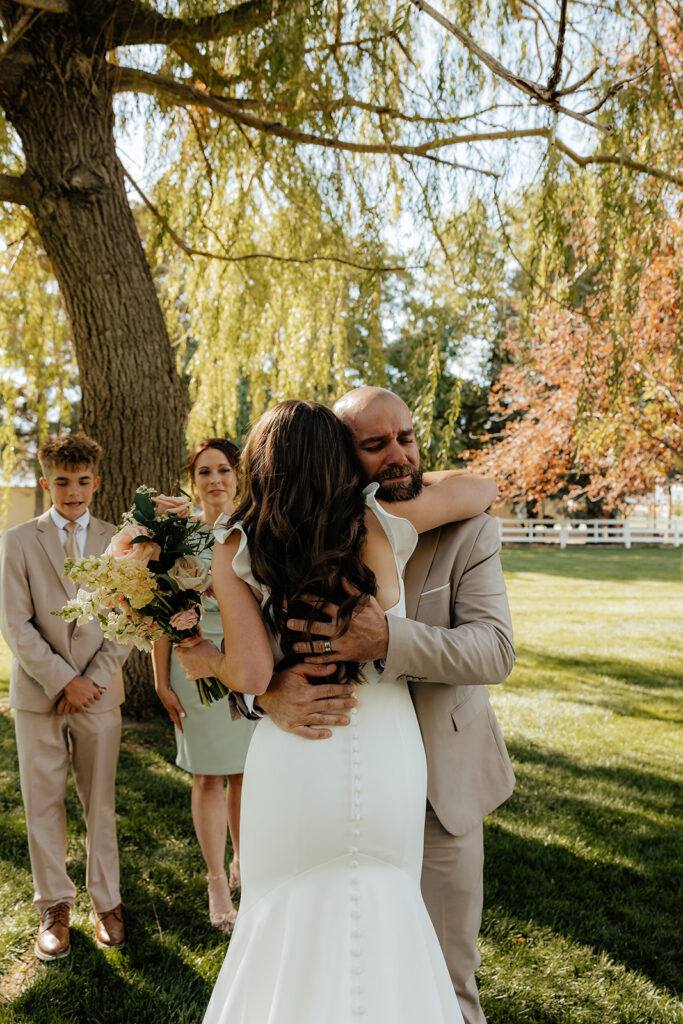 bride and her dad hugging 