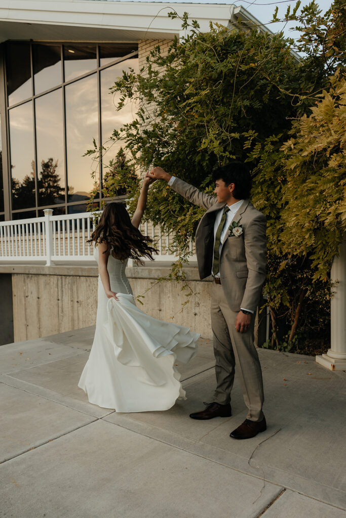 cute couple dancing during their bridal portraits 