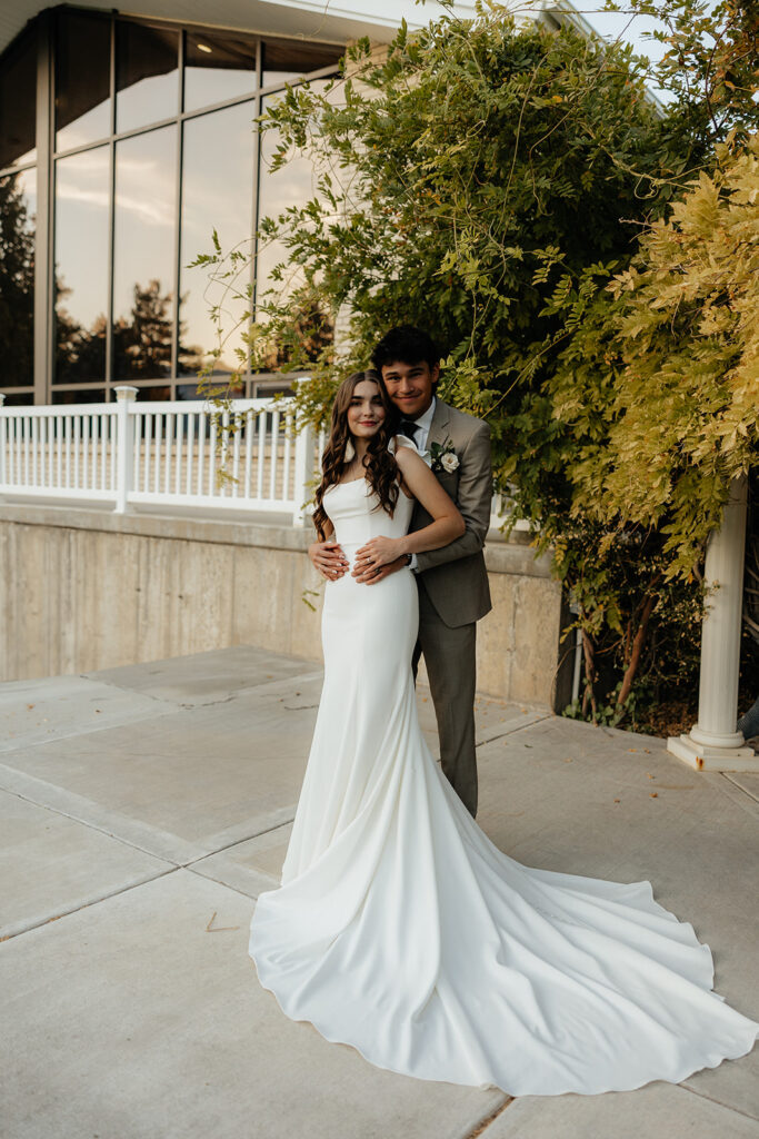 cute picture of the newlyweds hugging 