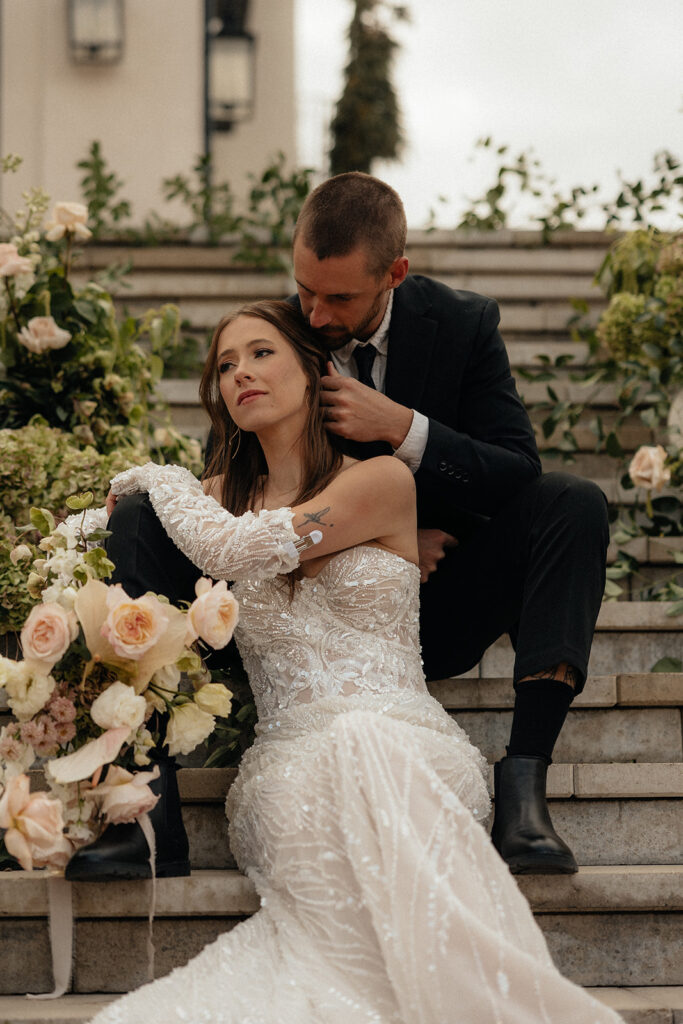 groom kissing the bride on the cheek