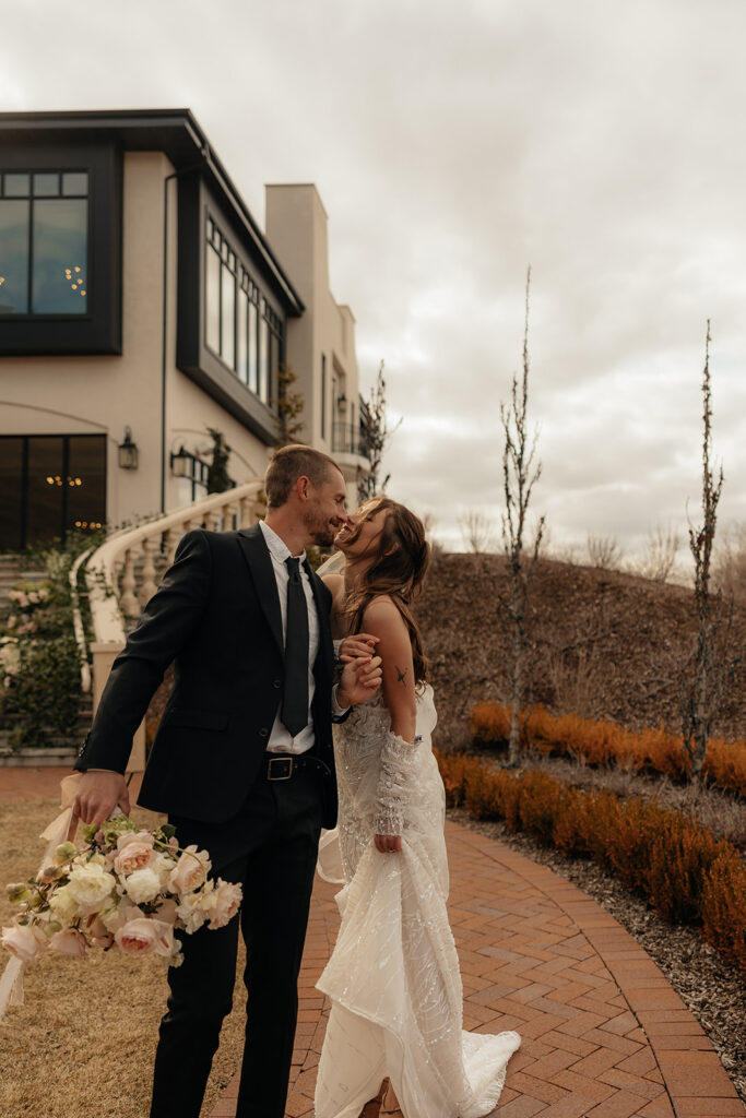 portrait of the newlyweds kissing