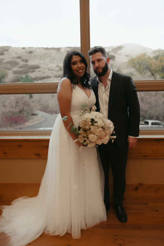 couple smiling at the camera during their bridal session