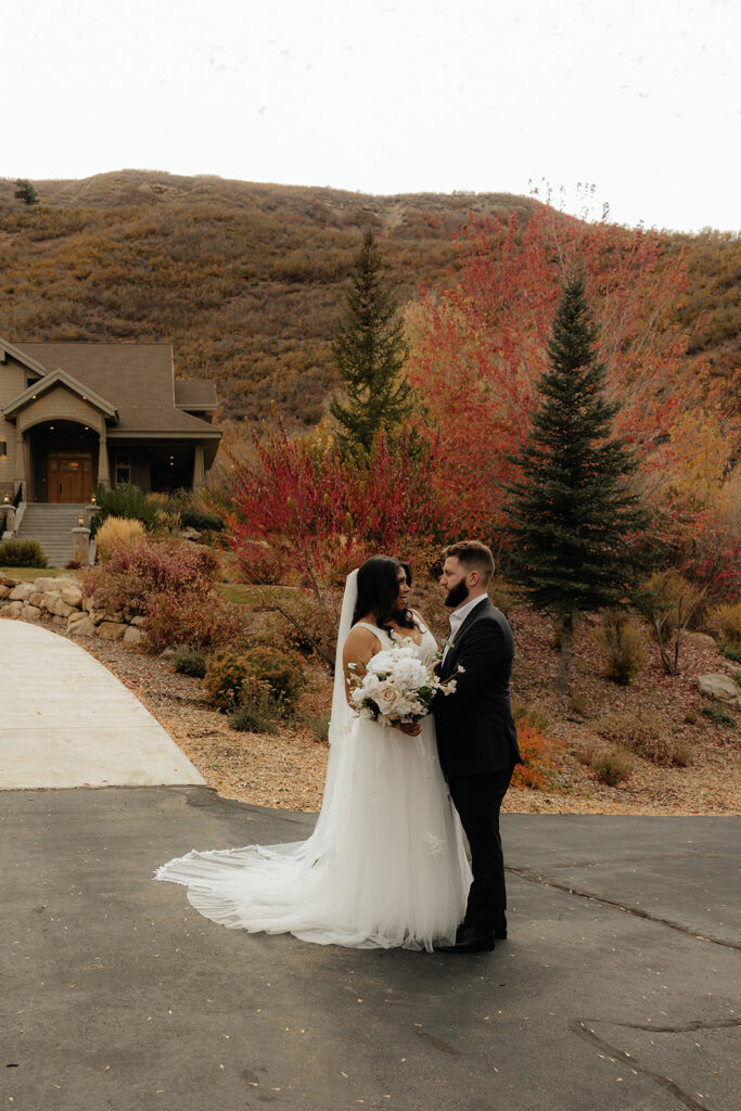 couple smiling at each other during their photoshoot